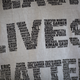A man wears a shirt bearing names of black people shot by police in the form of the words “Black Lives Matter” at the site where an unarmed black man, Alfred Olango, was shot and killed by police in El Cajon, Calif., earlier in the week of Sept. 29, 2016.
David McNew/Getty Images